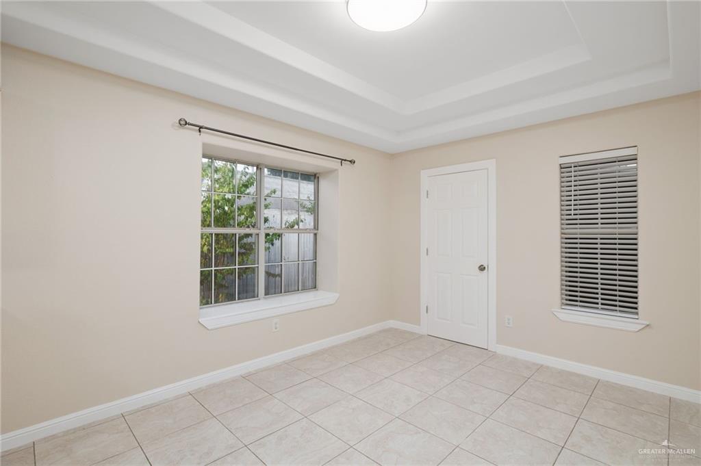 604 Hidden Trace Weslaco, TX 78599 - Photo 4 of 20 a view of empty room with windows