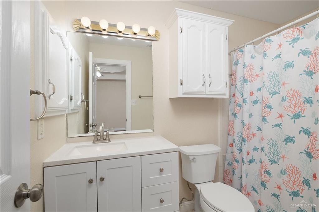 604 Hidden Trace Weslaco, TX 78599 - Photo 7 of 20 a bathroom with a sink a toilet and shower