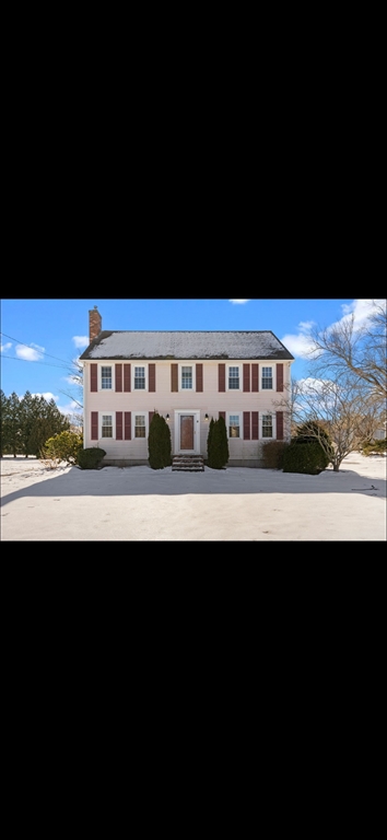 a view of a large building with a big yard