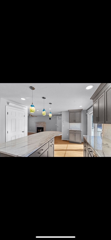 5 Vincent Road Attleboro, MA 02703 - Photo 11 of 32 a kitchen with a sink a stove and cabinets