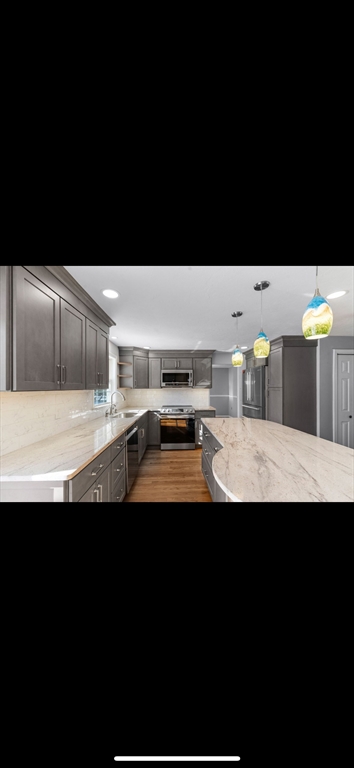 5 Vincent Road Attleboro, MA 02703 - Photo 13 of 32 a view of kitchen with stainless steel appliances granite countertop sink stove and microwave