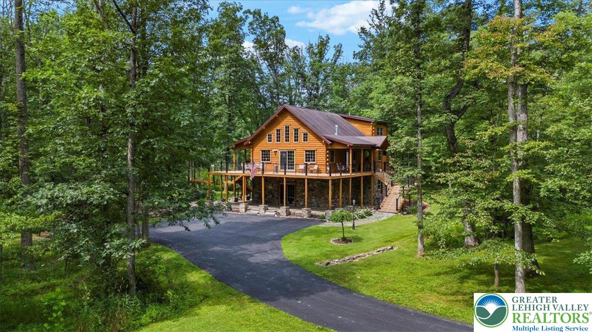207 West Douglasville Road Nazareth, PA 18064 - Photo 11 of 73 a front view of a house with a yard table and chairs