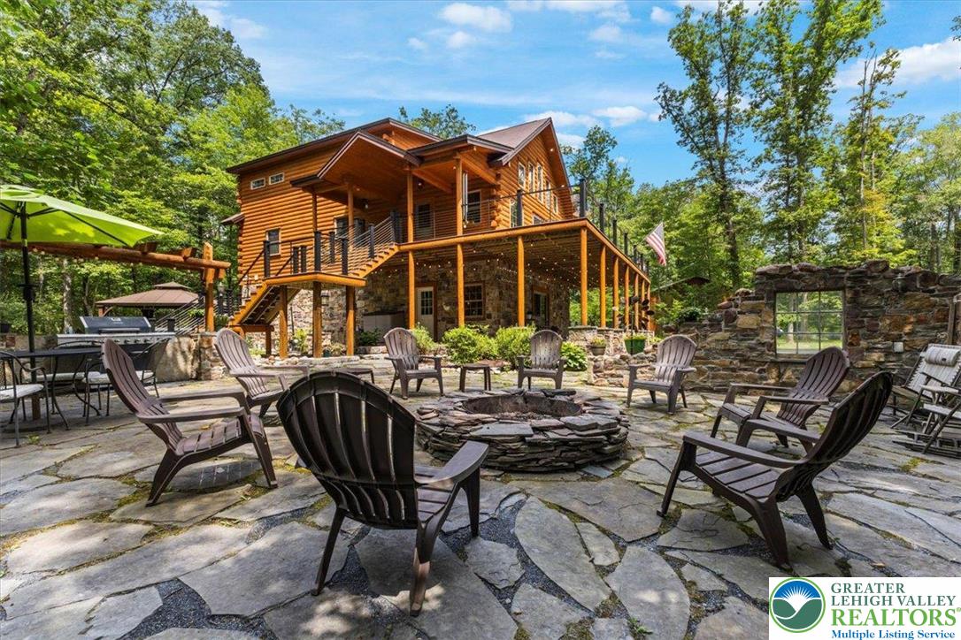 207 West Douglasville Road Nazareth, PA 18064 - Photo 14 of 73 a view of a chairs and table in backyard of the house