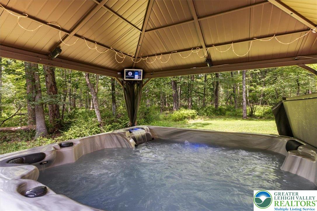 207 West Douglasville Road Nazareth, PA 18064 - Photo 18 of 73 a view of a patio with table and chairs under an umbrella