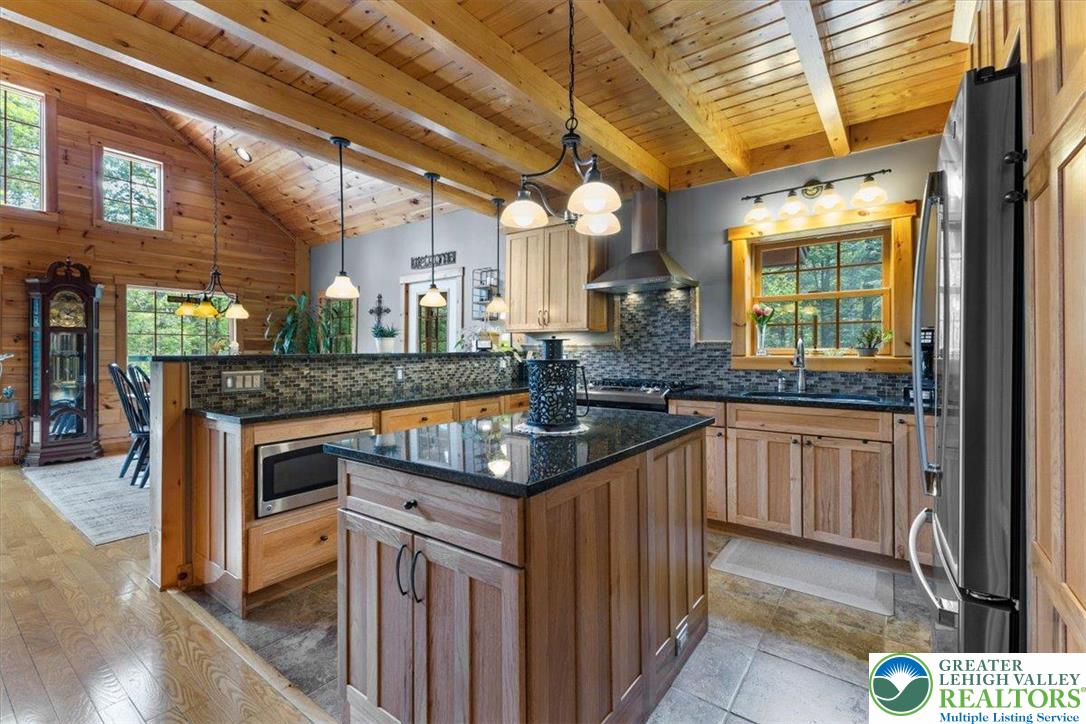 207 West Douglasville Road Nazareth, PA 18064 - Photo 31 of 73 a kitchen with granite countertop a sink and a stove