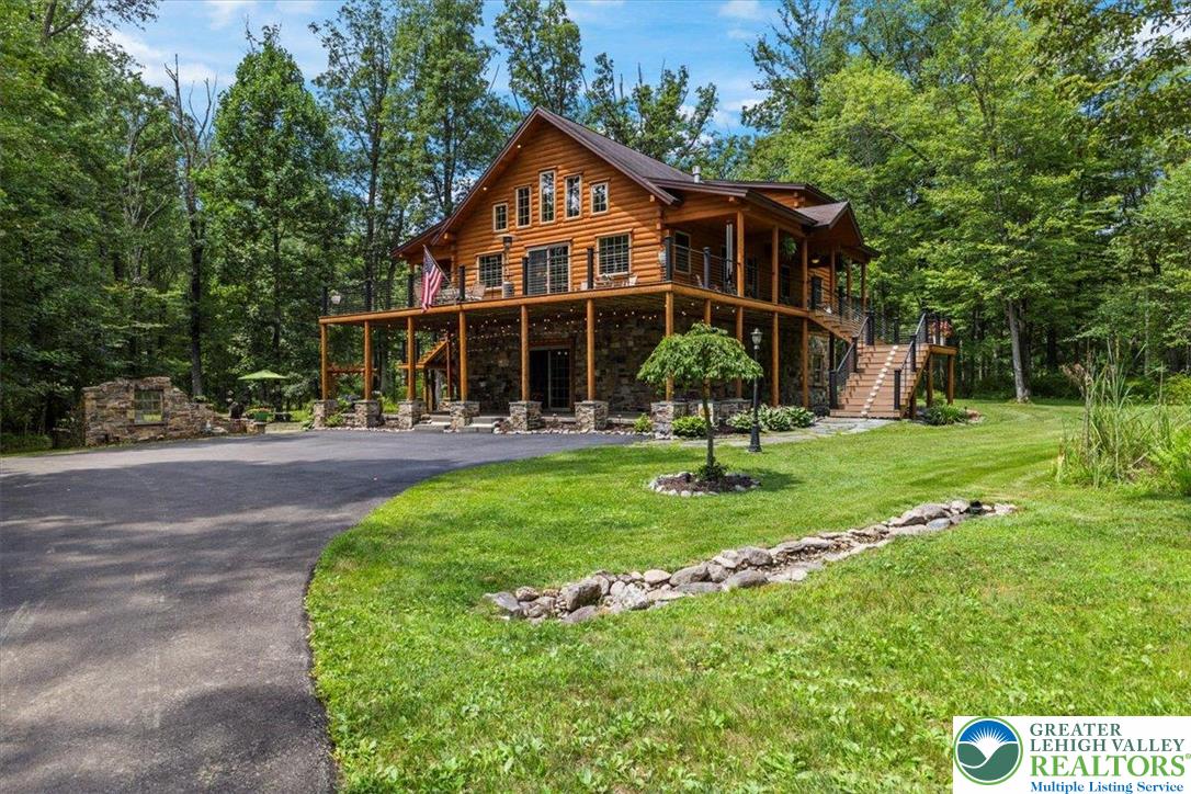 207 West Douglasville Road Nazareth, PA 18064 - Photo 4 of 73 a front view of a house with a yard table and chairs