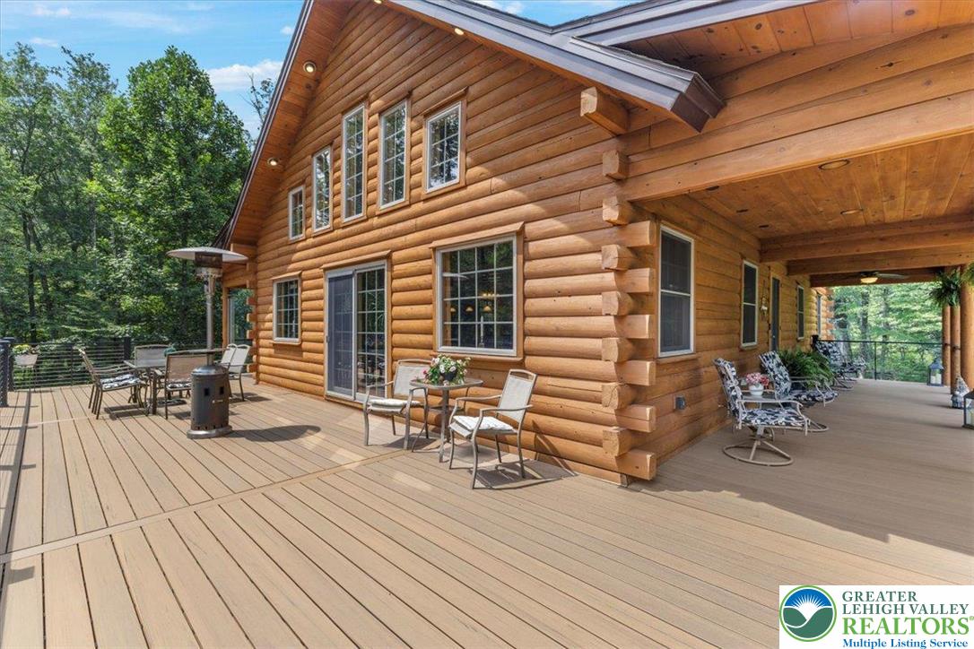 207 West Douglasville Road Nazareth, PA 18064 - Photo 8 of 73 a view of a patio with table and chairs with wooden floor and fence