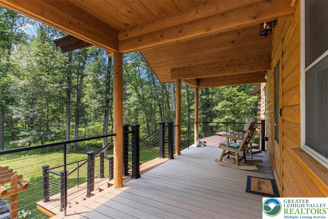 207 West Douglasville Road Nazareth, PA 18064 - Photo 9 of 73 a view of a balcony with chairs and wooden floor