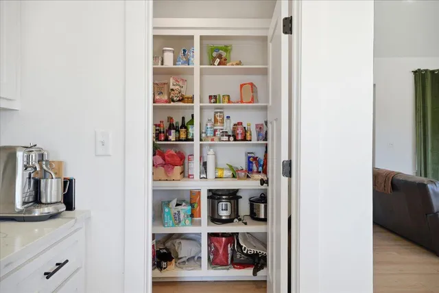 a kitchen with a refrigerator and cabinets