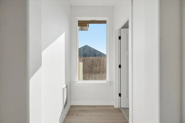 a view of a room that has a window in it