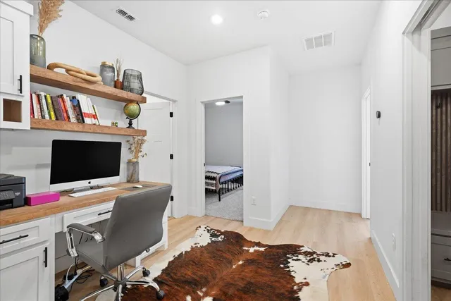 a bedroom with a bed and a television