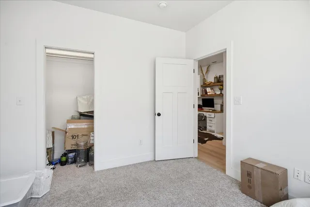 a view of a livingroom with furniture and cabinet
