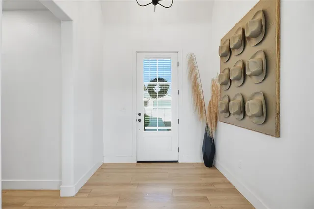 a view of an entryway with wooden floor