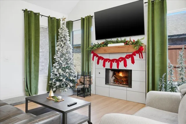 a living room with furniture and a flat screen tv