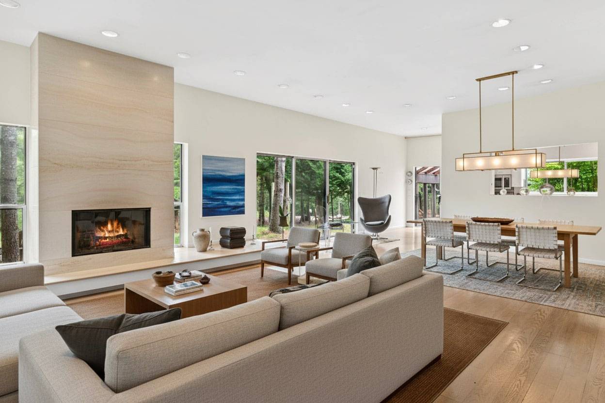 36 Edwards Hole Road East Hampton, NY 11937 - Photo 2 of 23 a living room with furniture fireplace and a large window