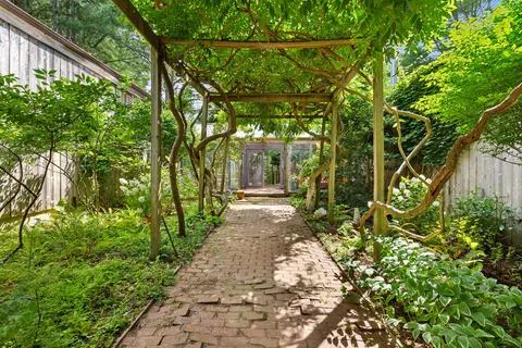 a view of a pathway with a yard