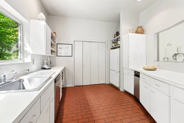 a bathroom with a sink a mirror and a shower