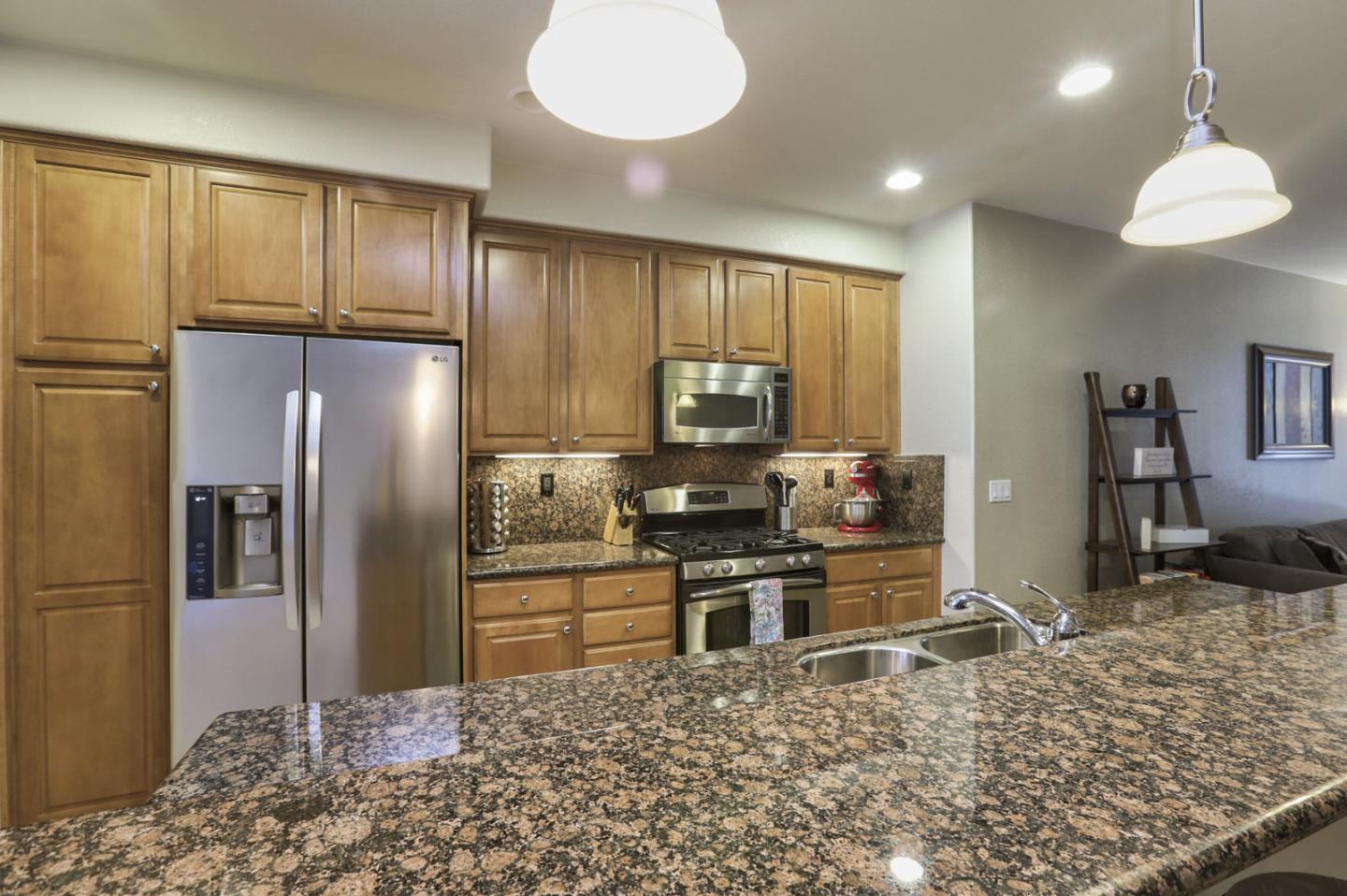 907 Rancho Place San Jose, CA 95126 - Photo 19 of 50 a kitchen with stainless steel appliances granite countertop a refrigerator a stove and a sink