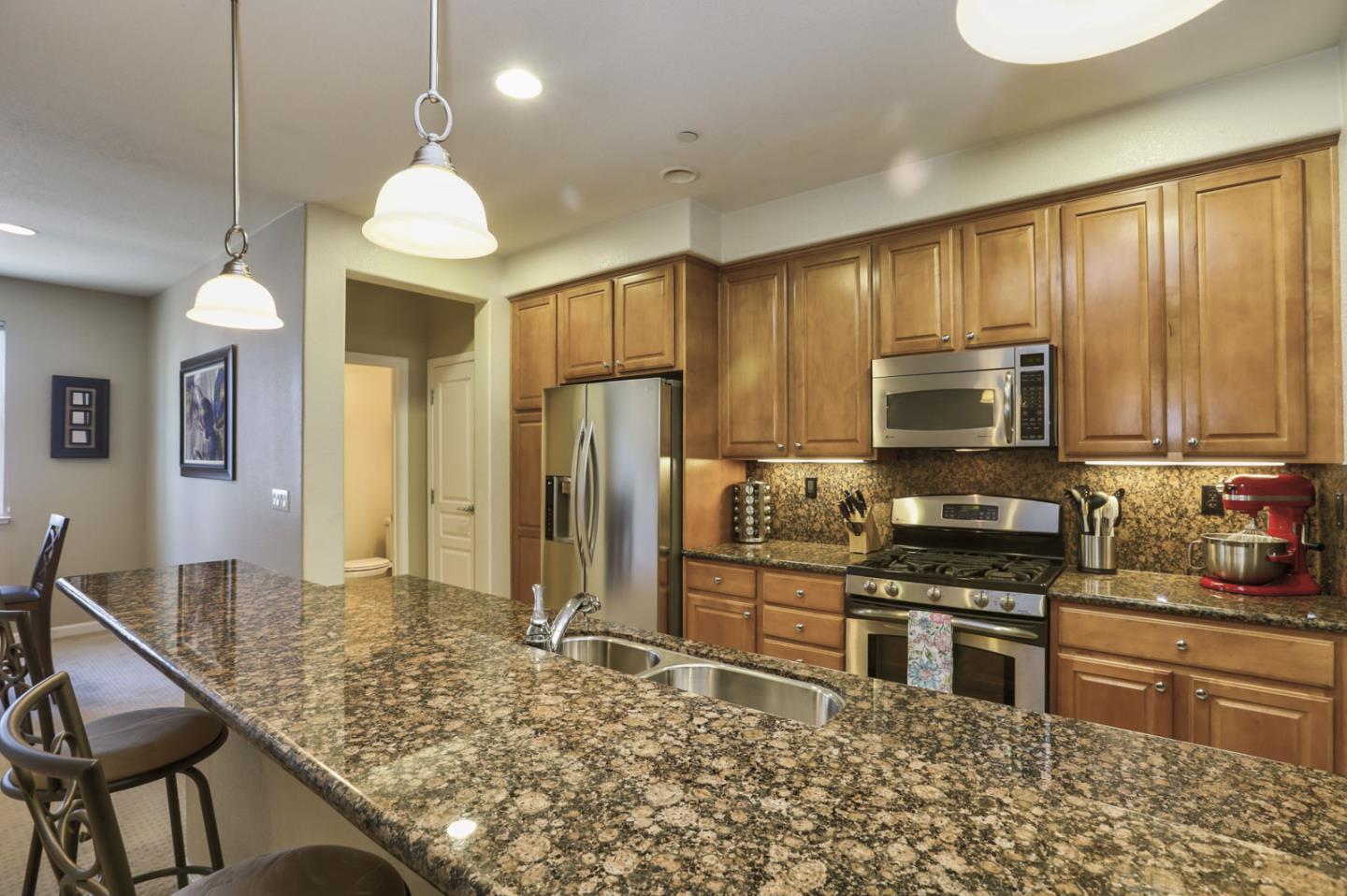 907 Rancho Place San Jose, CA 95126 - Photo 20 of 50 a kitchen with stainless steel appliances granite countertop a stove refrigerator and microwave