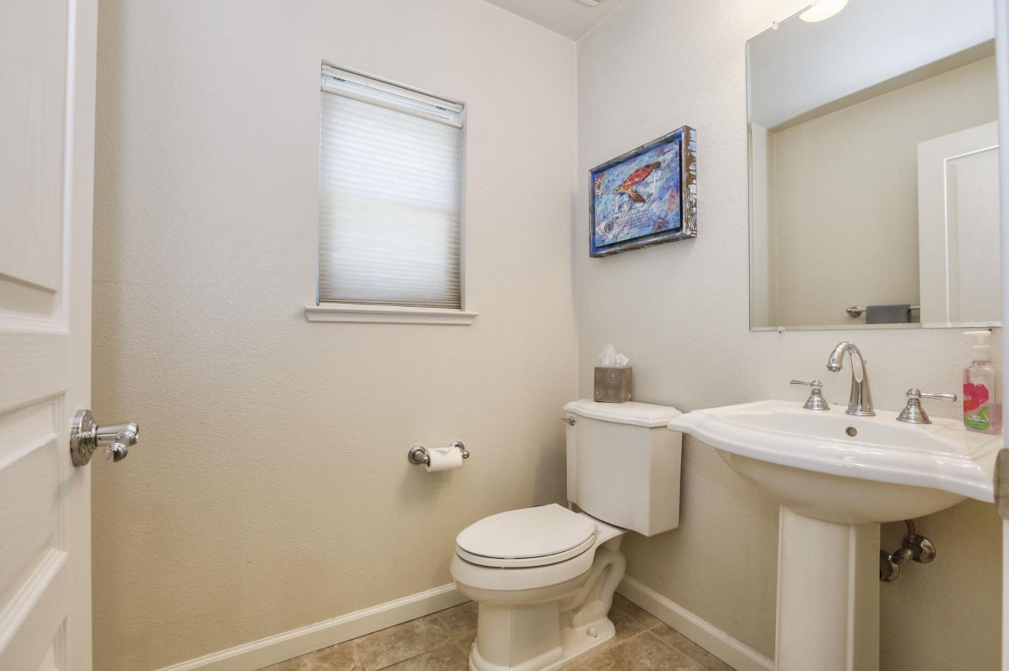 907 Rancho Place San Jose, CA 95126 - Photo 25 of 50 a bathroom with a toilet sink and mirror