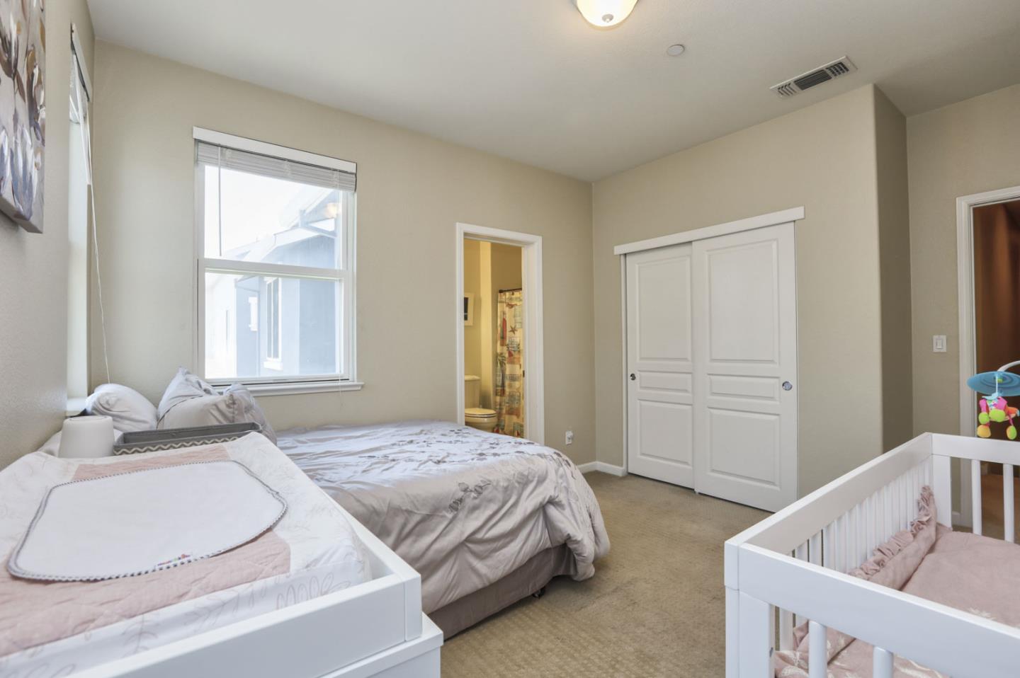 907 Rancho Place San Jose, CA 95126 - Photo 30 of 50 a bedroom with a bed and a window