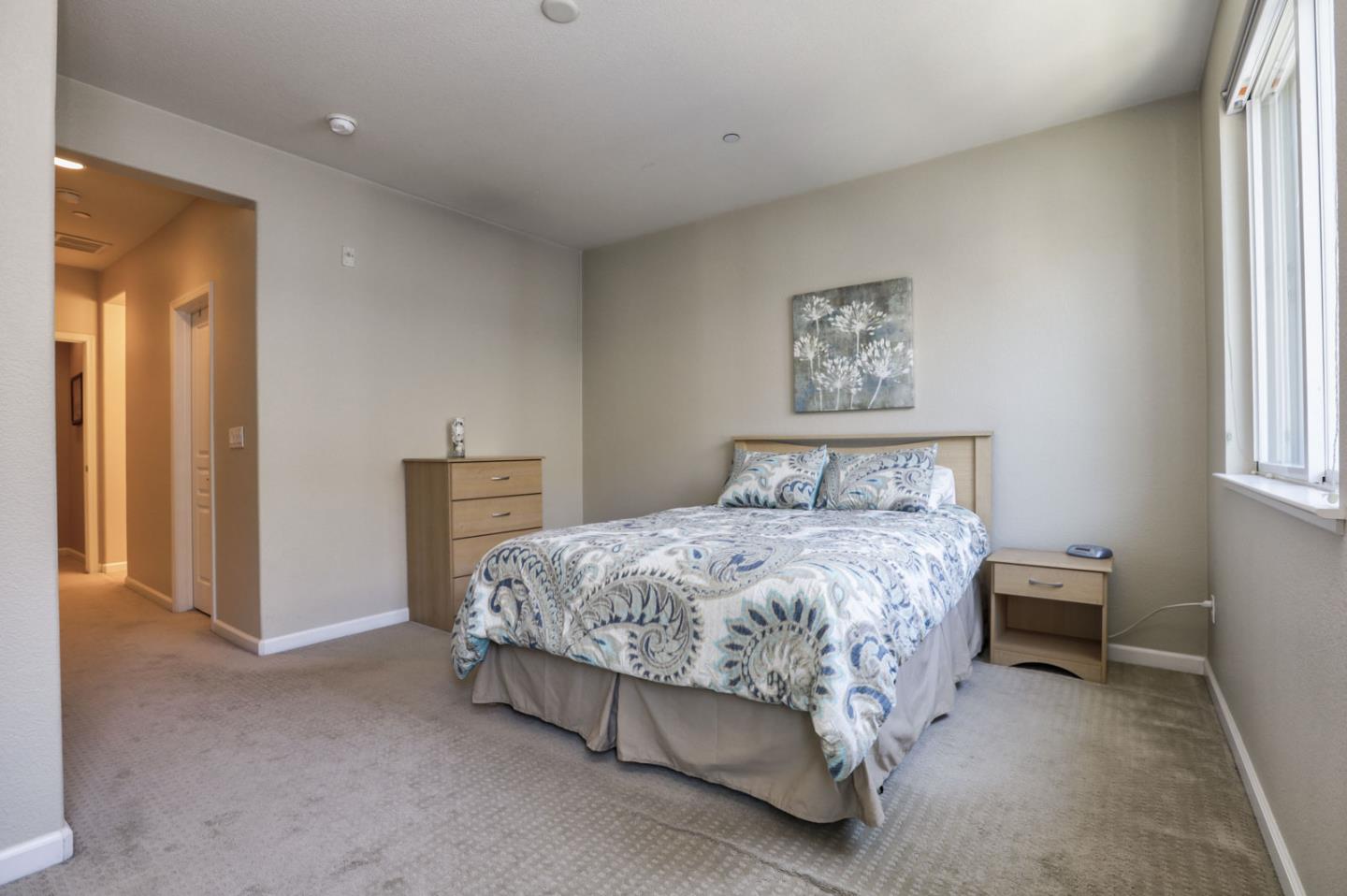 907 Rancho Place San Jose, CA 95126 - Photo 35 of 50 a spacious bedroom with a bed and a window