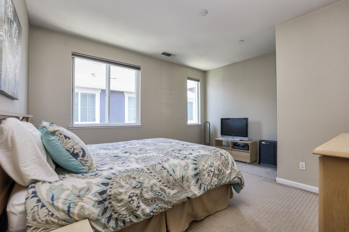 907 Rancho Place San Jose, CA 95126 - Photo 36 of 50 a bedroom with a bed flat screen tv and windows