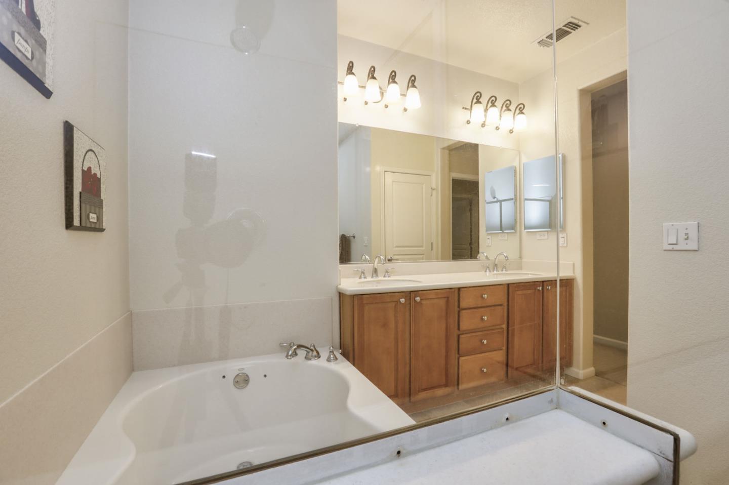907 Rancho Place San Jose, CA 95126 - Photo 39 of 50 a bathroom with a tub sink and mirror