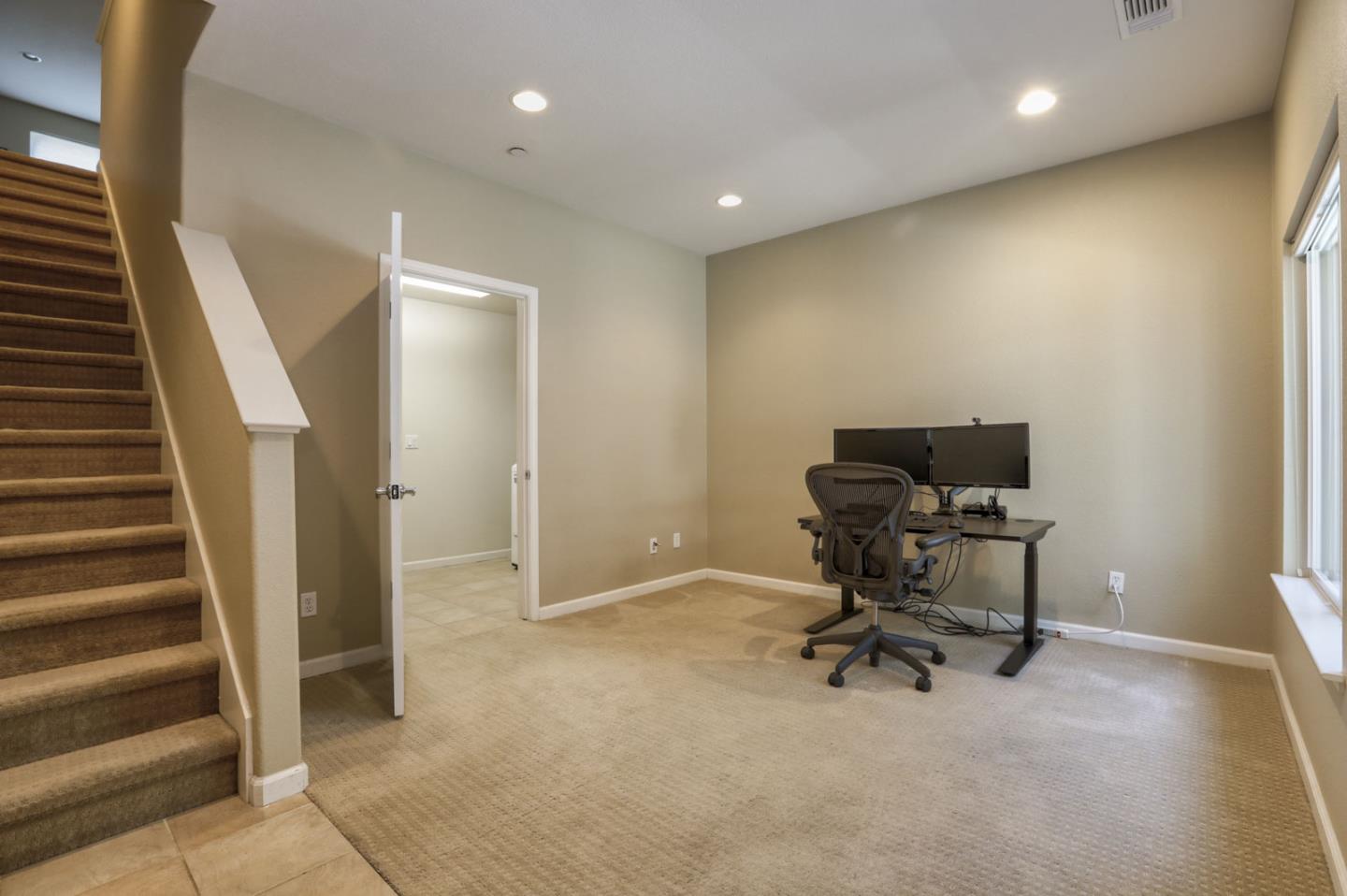907 Rancho Place San Jose, CA 95126 - Photo 7 of 50 a view of a workspace with furniture and stairs