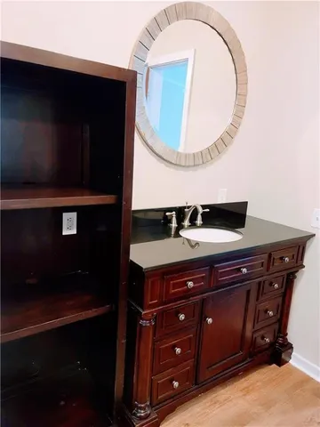 a bathroom with a sink and a mirror