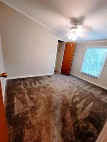 a bathroom with a granite countertop sink toilet a mirror and shower