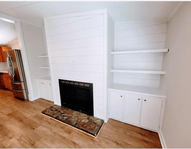 a room with closet and a fireplace