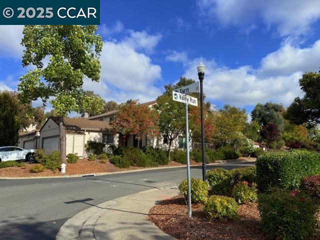 10 Tarn Court Hercules, CA 94547 - Photo 5 of 21 a view of a street with a building in the background