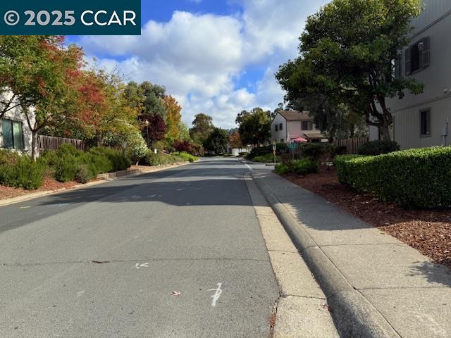 10 Tarn Court Hercules, CA 94547 - Photo 6 of 21 a view of a street with a building in the background