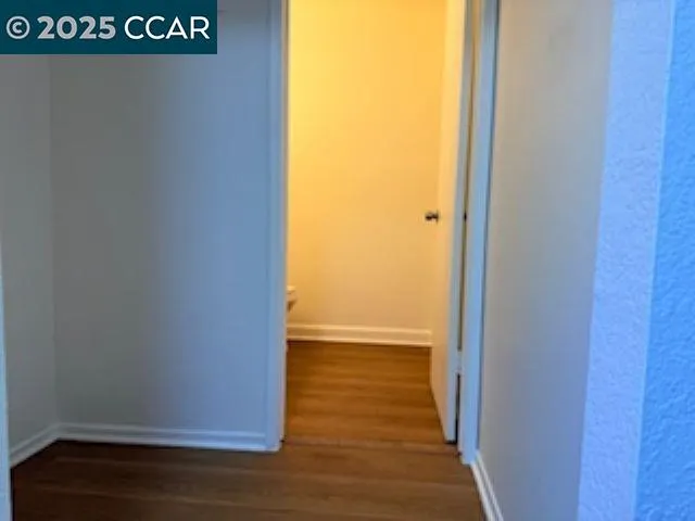 a kitchen with a refrigerator and a stove