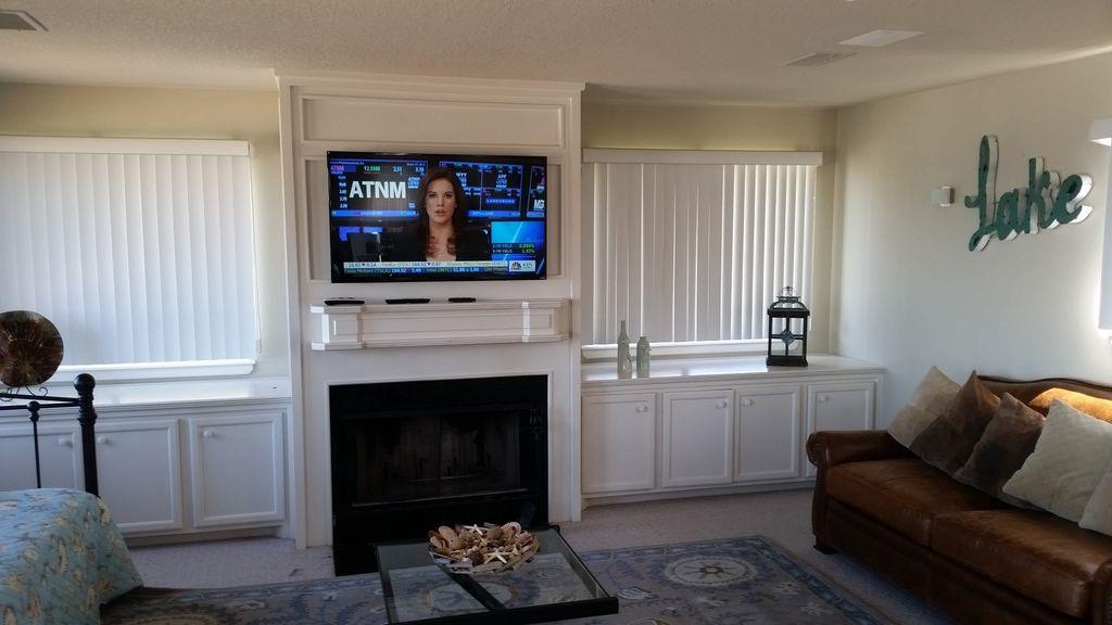 844 Beach Walk Boulevard Conroe, TX 77304 - Photo 14 of 20 a living room with furniture a fireplace and a window