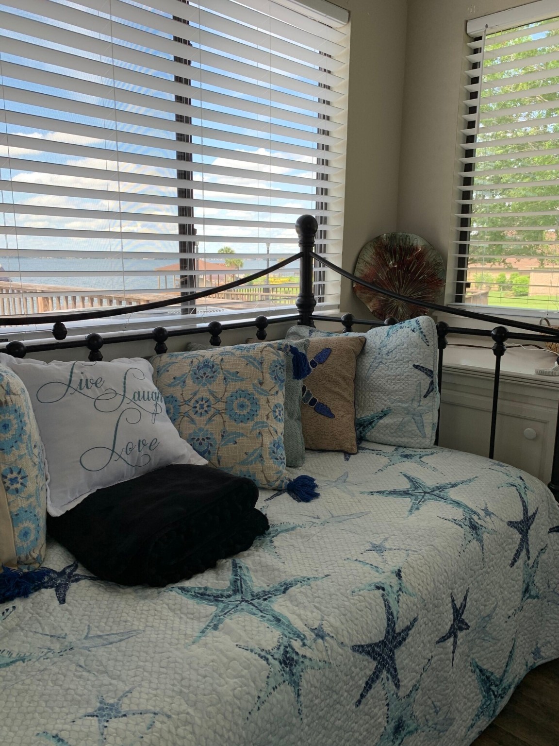 844 Beach Walk Boulevard Conroe, TX 77304 - Photo 15 of 20 a bed sitting in a bedroom next to a window