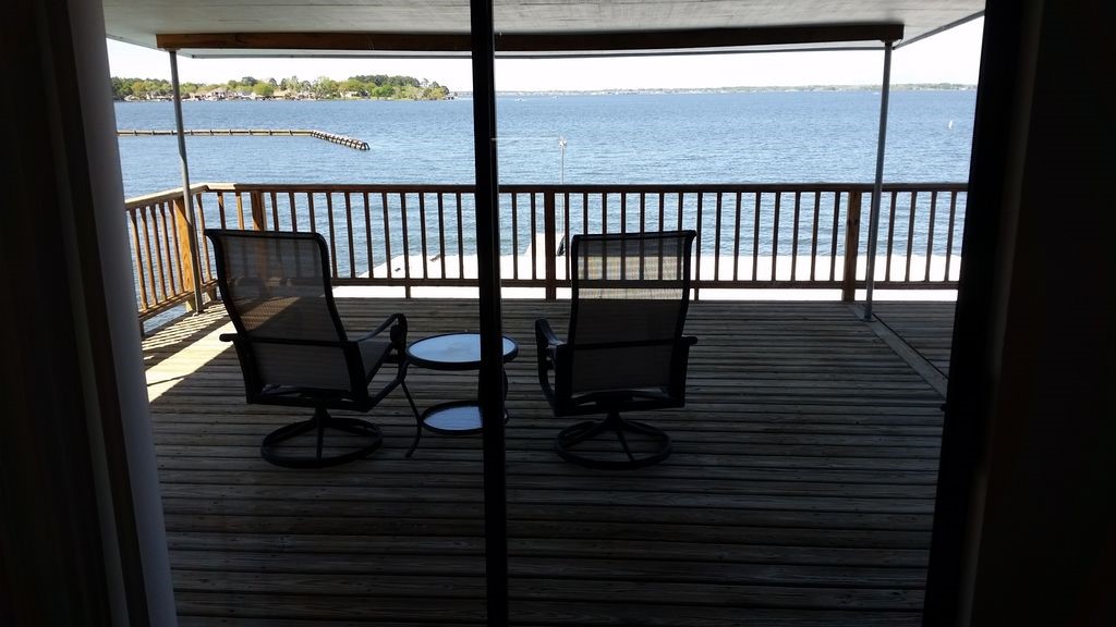 844 Beach Walk Boulevard Conroe, TX 77304 - Photo 4 of 20 a view of a chairs and table in patio