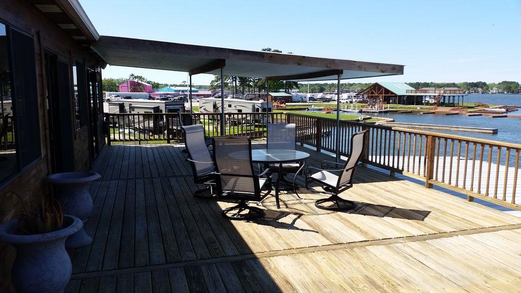 844 Beach Walk Boulevard Conroe, TX 77304 - Photo 8 of 20 a view of a chairs and table in the patio