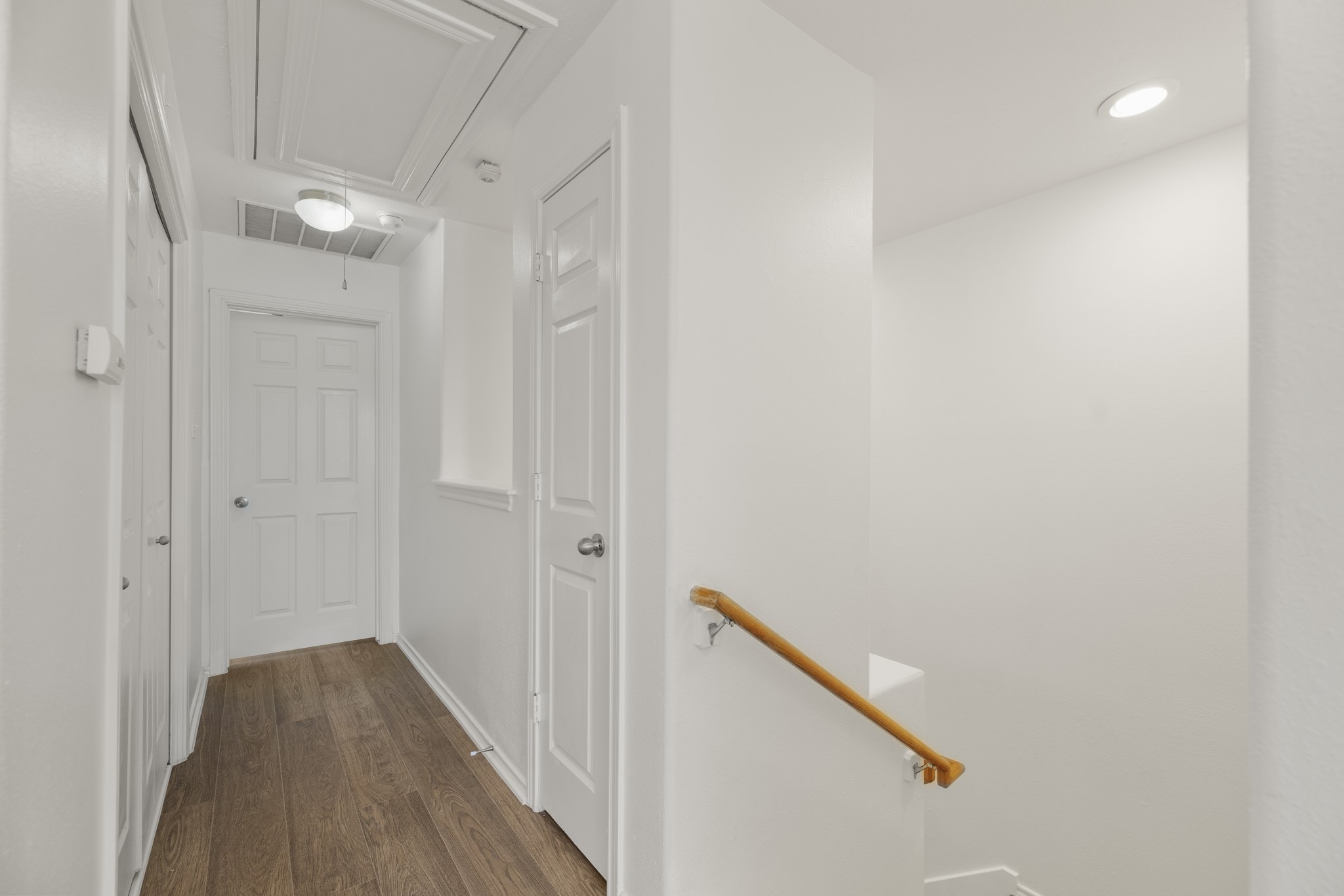 2911 Hackamore Hollow Lane Houston, TX 77014 - Photo 23 of 49 a view of a hallway with wooden floor and staircase