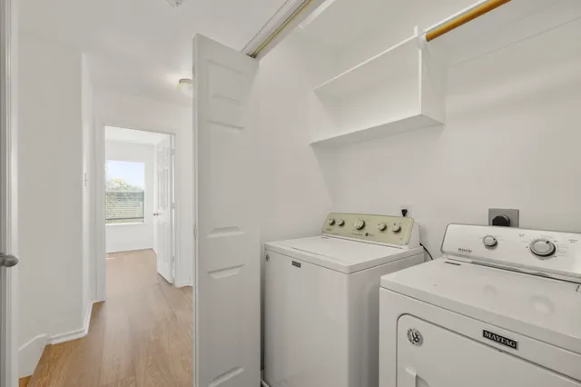 a view of storage and utility room with washer and dryer