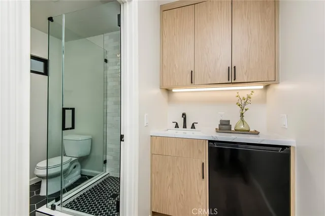 a kitchen with a sink and cabinets