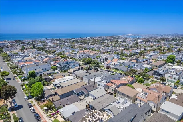 an aerial view of a city with lots of residential buildings