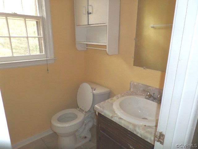 10649 Genlou Road Chesterfield, VA 23832 - Photo 14 of 18 a bathroom with a granite countertop toilet sink and mirror