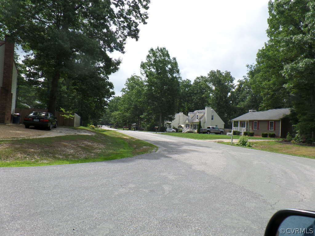 10649 Genlou Road Chesterfield, VA 23832 - Photo 15 of 18 a view of a house with a yard and garage