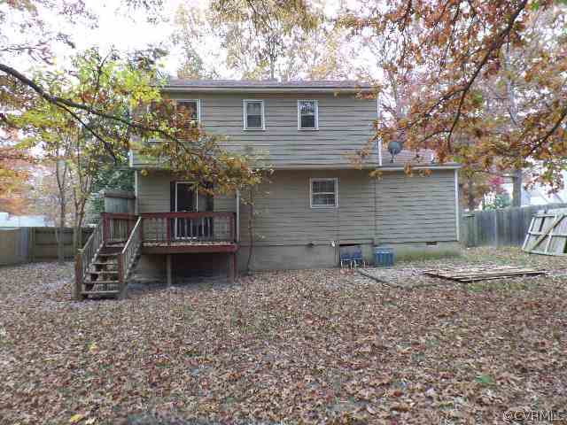 10649 Genlou Road Chesterfield, VA 23832 - Photo 16 of 18 a backyard of a house with barbeque oven