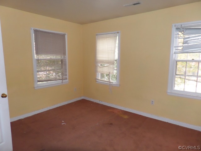 10649 Genlou Road Chesterfield, VA 23832 - Photo 8 of 18 an empty room with windows