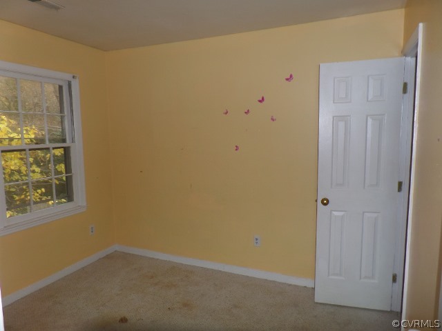 10649 Genlou Road Chesterfield, VA 23832 - Photo 9 of 18 an empty room with windows
