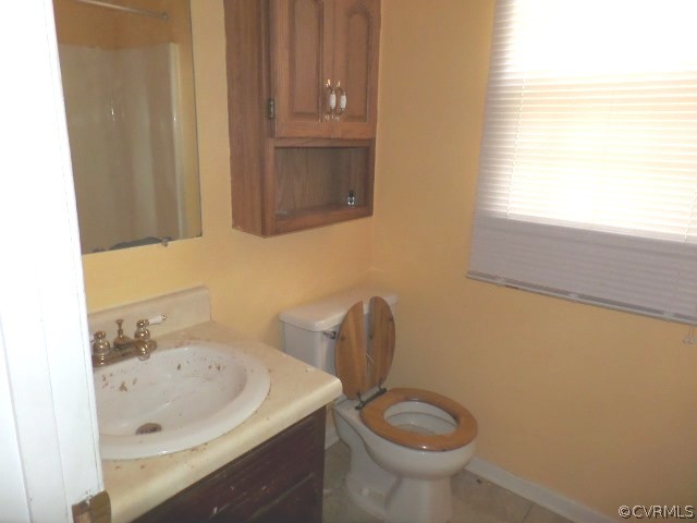 10649 Genlou Road Chesterfield, VA 23832 - Photo 10 of 18 a bathroom with a sink a toilet and a mirror