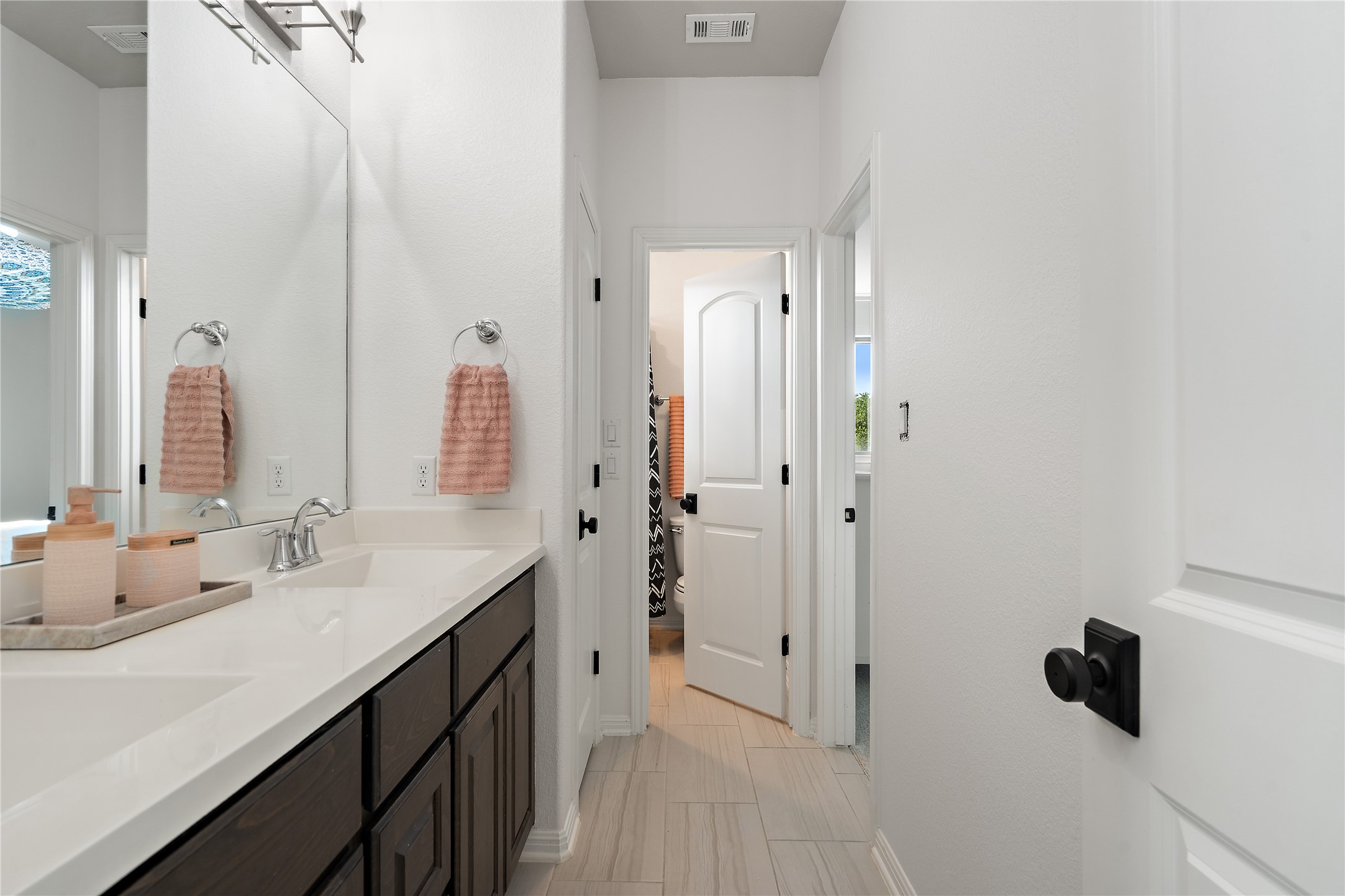 2829 Long Lasso Pass Leander, TX 78641 - Photo 26 of 40 a bathroom with a double vanity sink and mirror